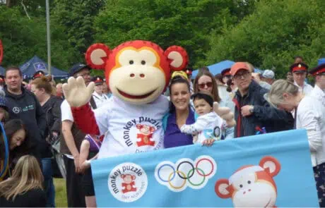 MPHW_Carrers_Image06 Marvin the Monkey with staff member and baby at Hartley Wintney Fair